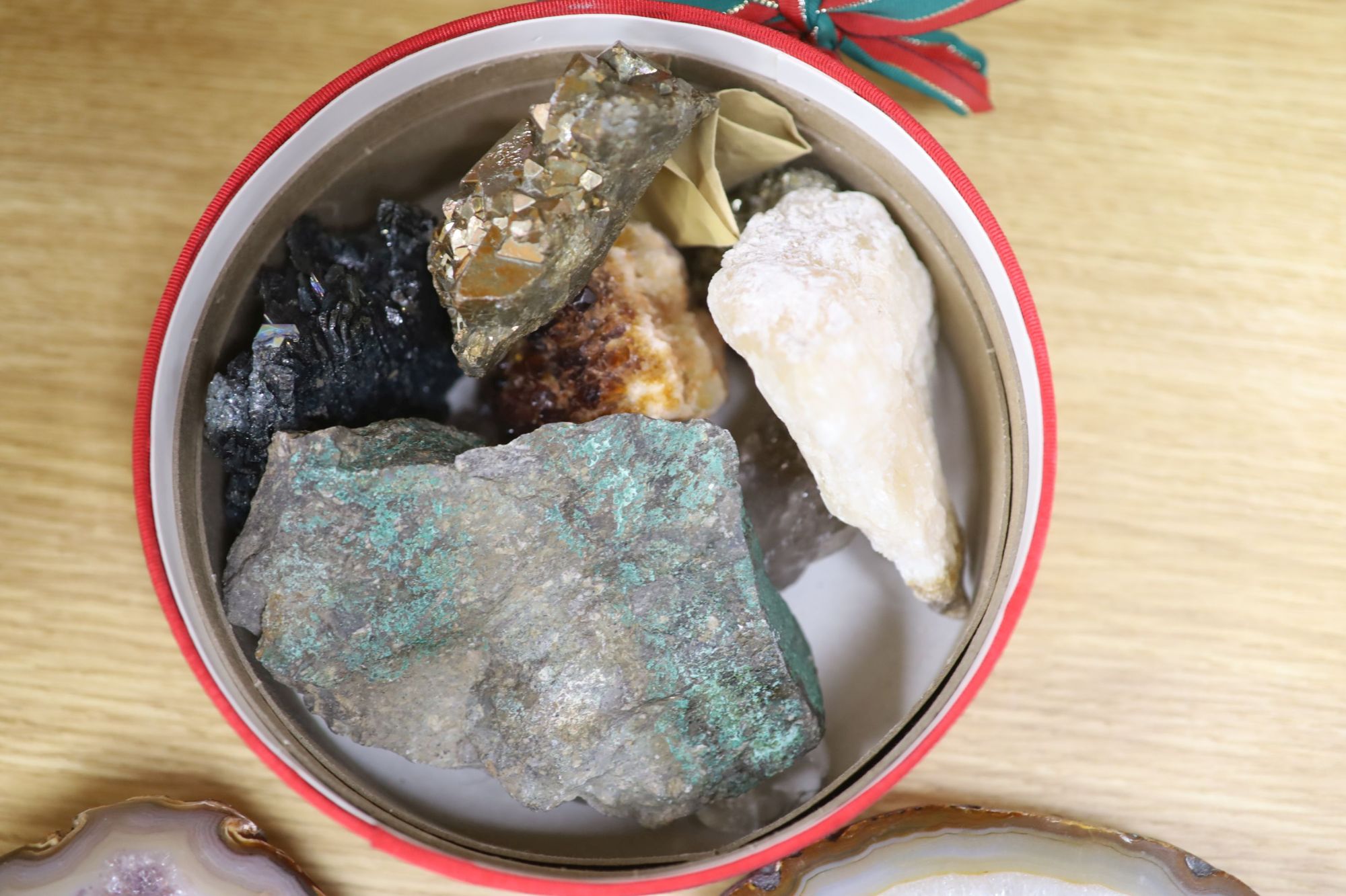 An amethyst geode section and assorted mineral specimens